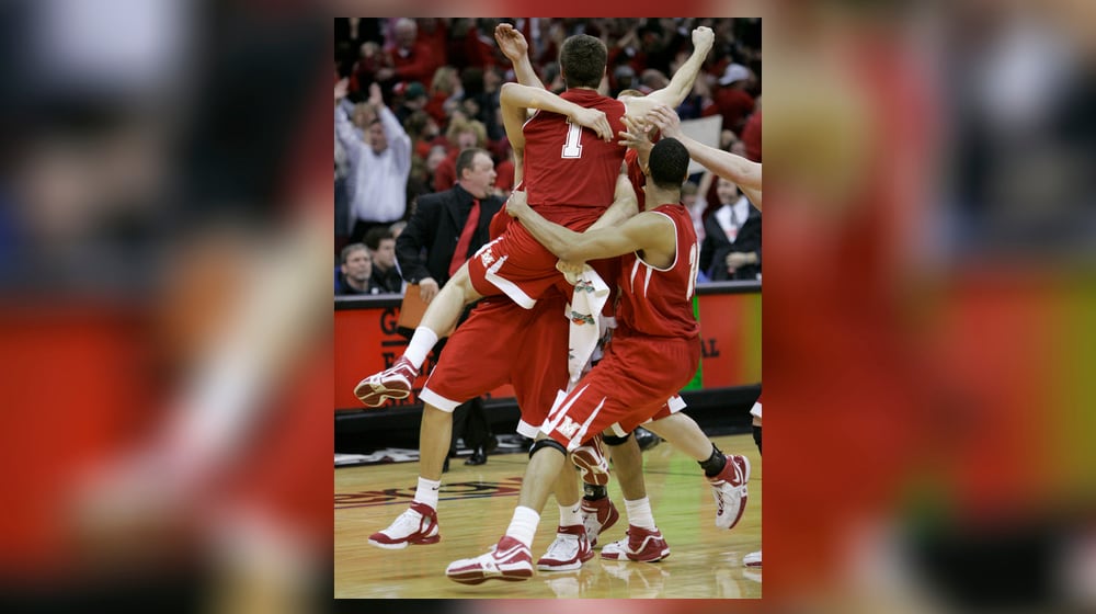 Miami's Doug Penno (1) is hoisted after banking home the game-winning 3-pointer in the second half of the Mid-American Conference men's basketball tournament championship game Saturday, March 10, 2007, in Cleveland. Miami defeated Akron 53-52 to advance to the NCAA Tournament. (AP Photo/Tony Dejak)