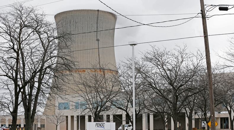 FILE – This April 4, 2017, file photo shows the entrance to FirstEnergy Corp.'s Davis-Besse Nuclear Power Station in Oak Harbor, Ohio. Akron-based FirstEnergyCorp. argues that political donations are protected by the First Amendment and a federal criminal complaint failed to provide evidence that money was exchanged for official favors, according to a motion filed by company attorneys seeking dismissal of shareholder lawsuits. (AP Photo/Ron Schwane, File)