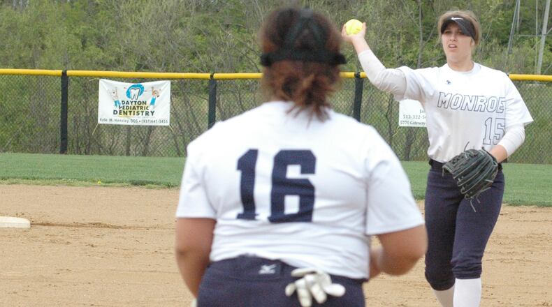 Monroe second baseman Bri Rose (15) throws to first baseman Makenzi Moore for an out Wednesday during a Southwestern Buckeye League Southwestern Division softball game against Eaton at Monroe. Eaton won 5-1. RICK CASSANO/STAFF