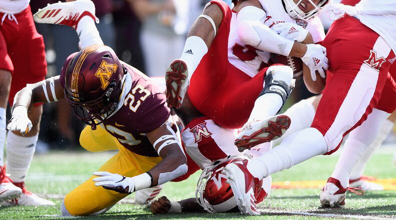 MINNEAPOLIS, MN - SEPTEMBER 15: Jordan Howden #23 of the Minnesota Golden Gophers tackles Maurice Thomas #31 of the Miami (Oh) Redhawks on the opening kickoff return of the game on September 15, 2018 at TCF Bank Stadium in Minneapolis, Minnesota. (Photo by Hannah Foslien/Getty Images)