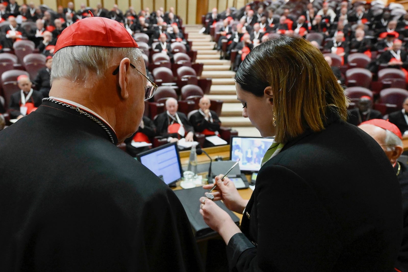 A Vatican employee annulls the papal seal, at the Vatican, Tuesday, May 6, 2025. (Vatican Media via AP)
