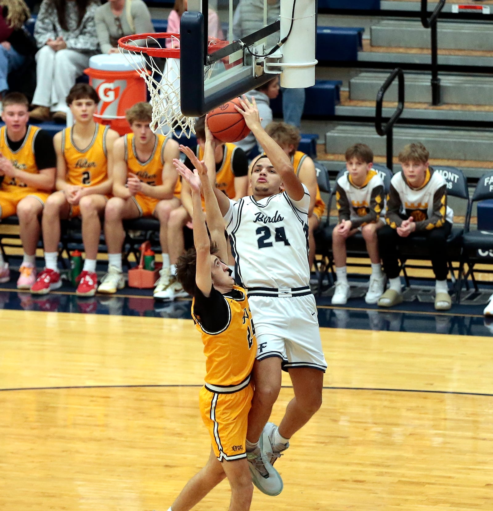 Fairmont junior Jayden McGraw goes over Alter senior Bram Miller on a layup attempt during their game against Alter on Tuesday, Feb. 3, 2026, at Trent Arena in Kettering. Alter won 70-61. STEVEN WRIGHT / STAFF