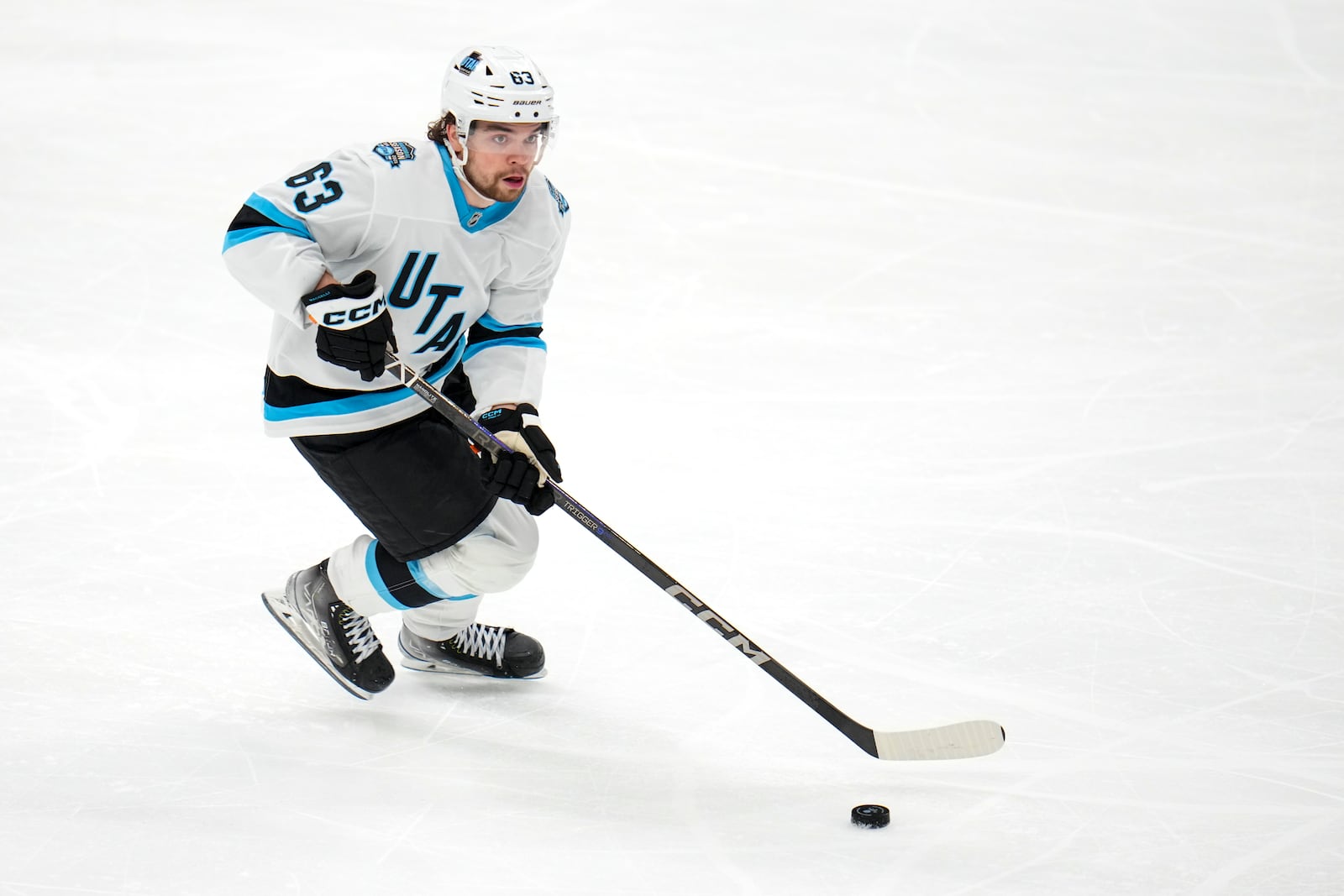 FILE - Utah Hockey Club left wing Matias Maccelli skates with the puck against the Dallas Stars during the third period of an NHL hockey game, Jan. 4, 2025, in Dallas. (AP Photo/Julio Cortez, file)