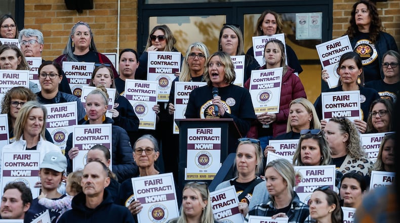Teacher and Ross Education Association spokesperson Amy Brossart speaks as more than 100 Ross Local Schools teachers gather for a rally Wednesday, Nov. 5 while contract mediation talks are going on inside the Ross Local Schools Administrative Offices. NICK GRAHAM/STAFF