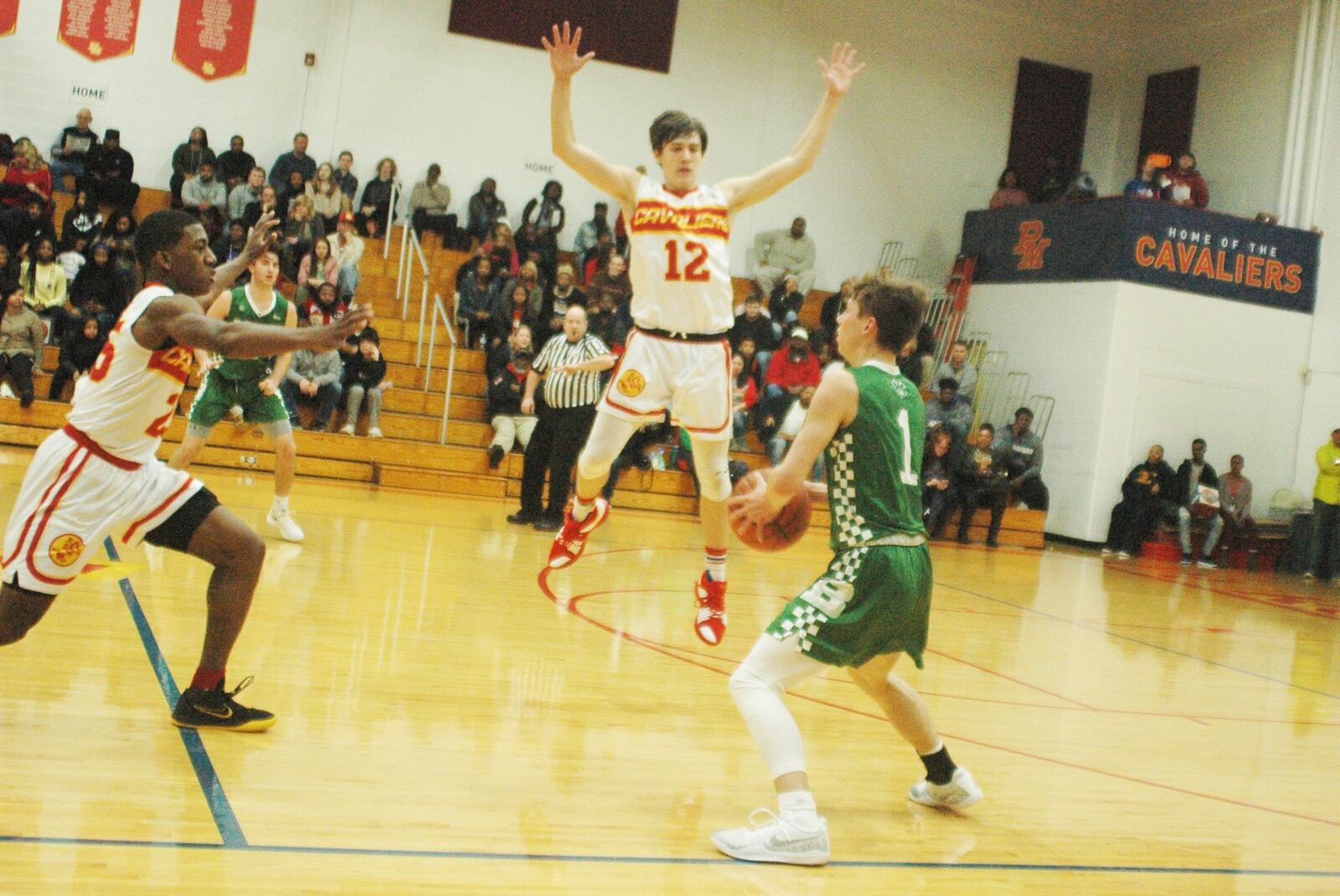 Badin’s Joseph Walsh (1) is pressured by Purcell Marian’s Jared Baldock (12) and Dustin Davis (25) during Friday night’s game at the Eveslage Athletic Center. Host Purcell won 74-60. RICK CASSANO/STAFF