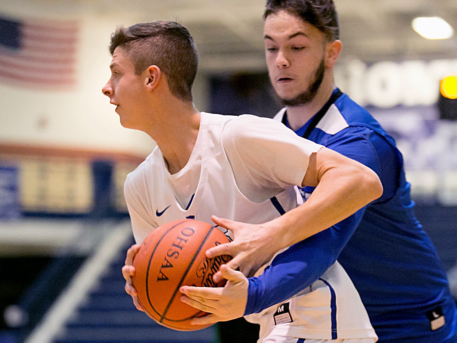 Hamilton guard Zack Morgan gets his hand on the ball as Cincinnati Christian guard Johnny Nimmo moves toward the basket Saturday night during the All-Butler County All-Star boys basketball game at the Hamilton Athletic Center. CONTRIBUTED PHOTO BY E.L. HUBBARD
