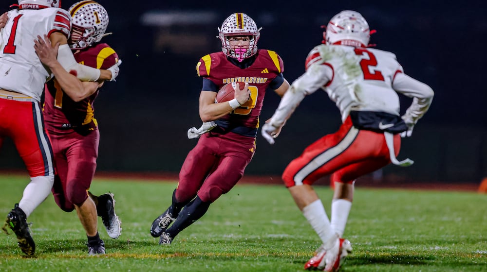 Northeastern High School senior Jacoby Newman runs the ball during their 59-0 victory over Ironton Rock Hill in a Division VI, Region 24 quarterfinal game on Friday, Nov. 7 at Conover Stadium in Springfield. MICHAEL COOPER / STAFF PHOTO