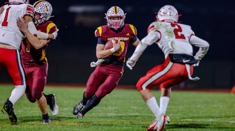 Northeastern High School senior Jacoby Newman runs the ball during their 59-0 victory over Ironton Rock Hill in a Division VI, Region 24 quarterfinal game on Friday, Nov. 7 at Conover Stadium in Springfield. MICHAEL COOPER / STAFF PHOTO
