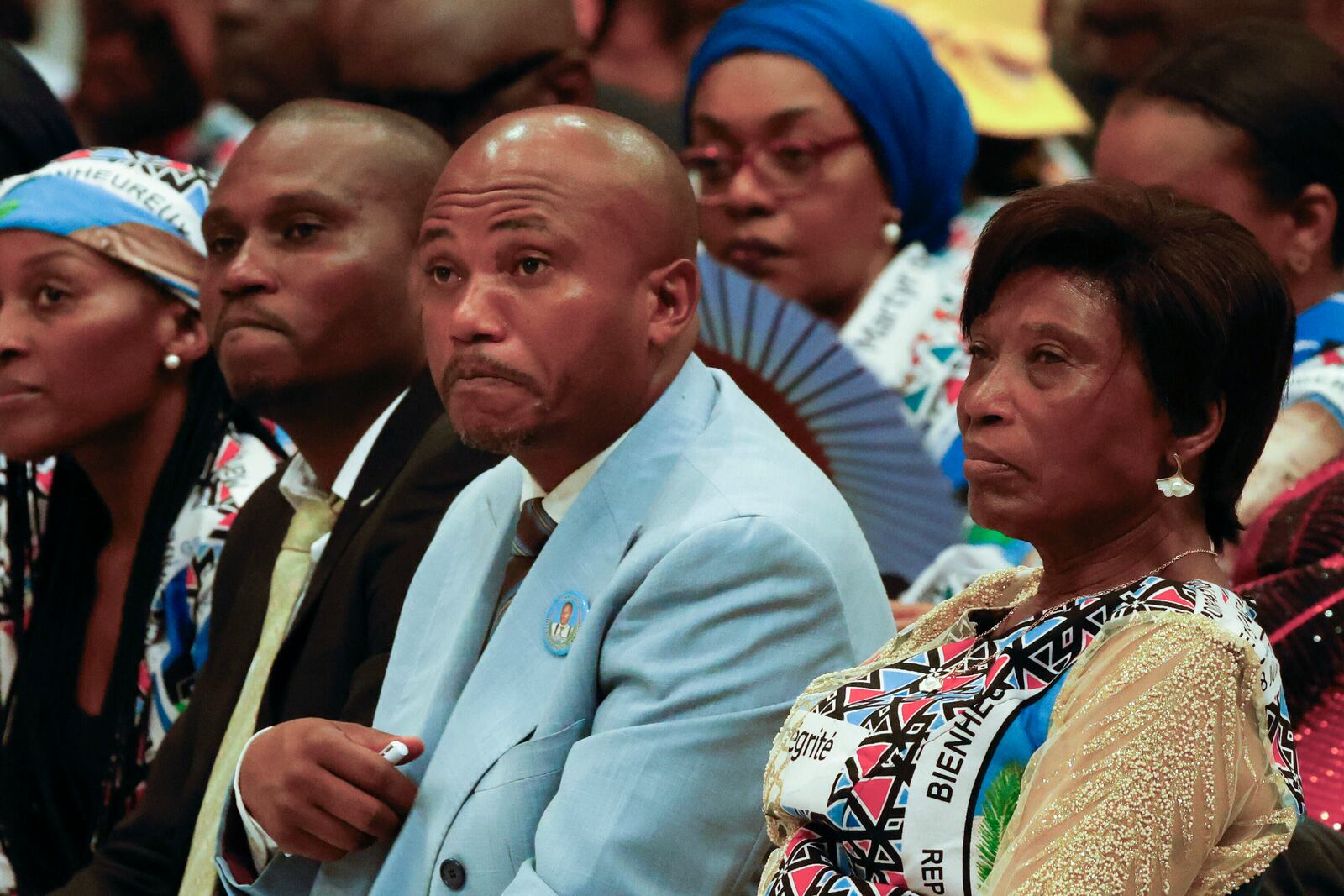 From right, Gertrude Kamara Ntawiha, mother of Floribert Bwana Chui Bin Kositi, a Congolese man killed in 2007 for fighting corruption, and his brothers Jean-Claude, center, and Tresor, attend a ceremony for his beatification in St. Paul Outside the Walls' Basilica, in Rome, Sunday, June 15, 2025. (AP Photo/Riccardo De Luca)