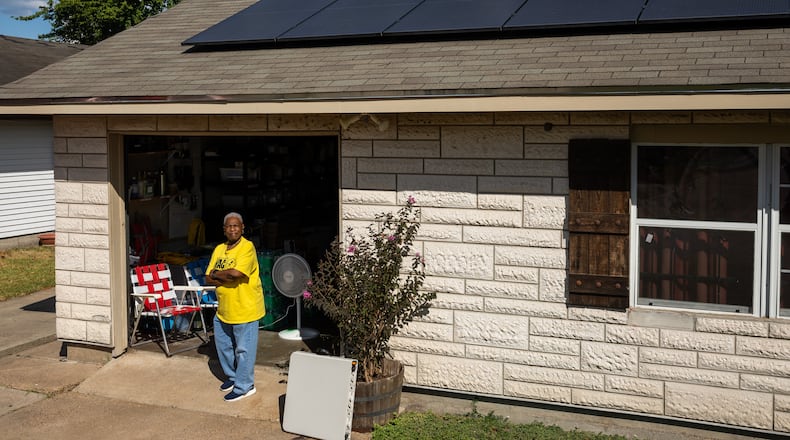 Doris Brown, Hub home captain, poses for a portrait under her solar panels on Wednesday, Oct. 8, 2025, in Houston. (AP Photo/Antranik Tavitian)