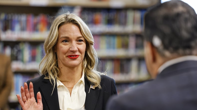 Lakota Board of Education member Darbi Boddy, shown here being sworn on to the board in January, has sharply criticized Lakota Superintendent Matt Miller and claims he is being unresponsive to her request for more information and his personal definition of Critical Race Theory (CRT). Boddy says her election to the board was in large part due to her publicly stance against CRT lessons and her allegations such lessons are being taught in Lakota schools. Lakota officials, however, have contended CRT is not taught to students. NICK GRAHAM / STAFF
