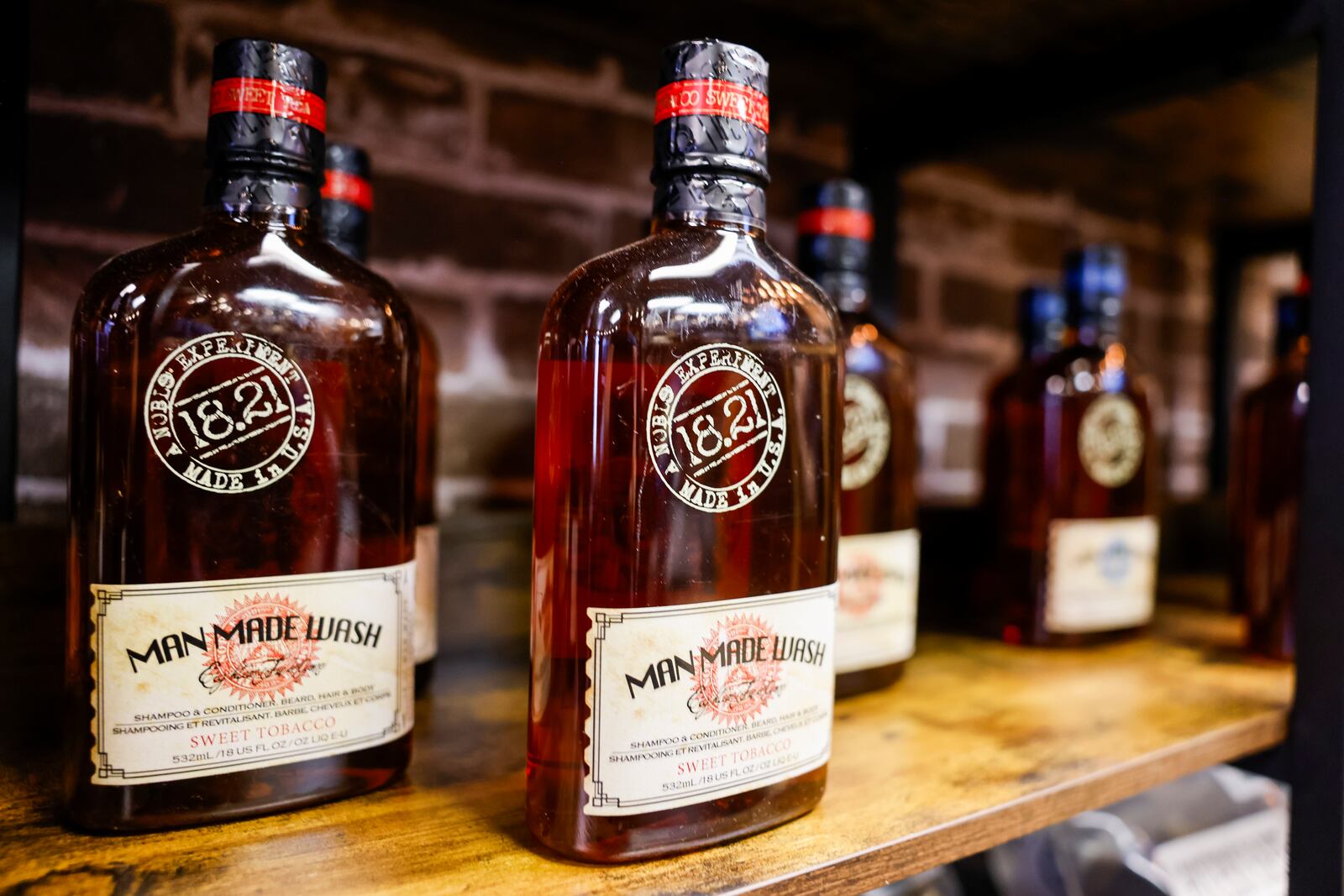 Bourbon and Fire will open their new storefront Wednesday, June 28 on Main Street in Hamilton. The store features custom laser engraved bourbon barrel lid games and decor, mixers, cigars and more. The back of the shop has a curated clothing boutique. NICK GRAHAM/STAFF