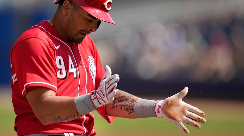 Cincinnati Reds' Christian Encarnacion-Strand celebrates after hitting a triple during the third inning of a spring training baseball game against the San Diego Padres, Wednesday, March 8, 2023, in Peoria, Ariz. (AP Photo/Abbie Parr)