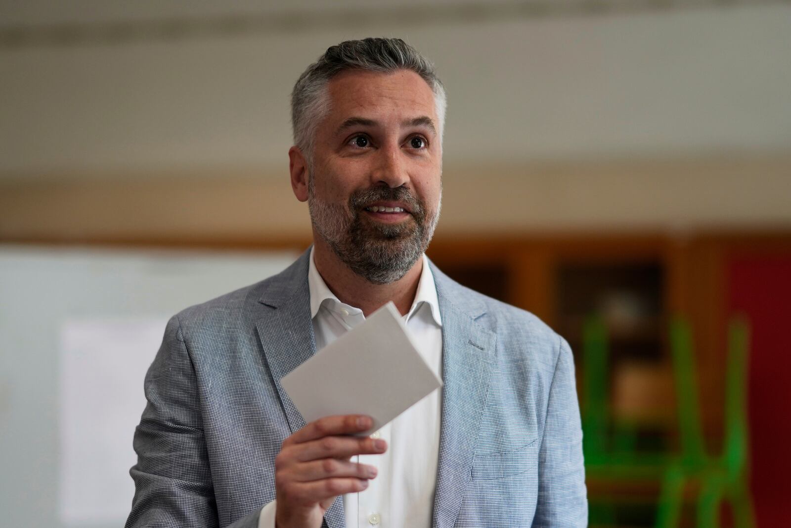 Socialist Party secretary general Pedro Nuno Santos holds his ballot when voting in Portugal's general election at a polling station in Lisbon, Sunday, May 18, 2025. (AP Photo/Armando Franca)