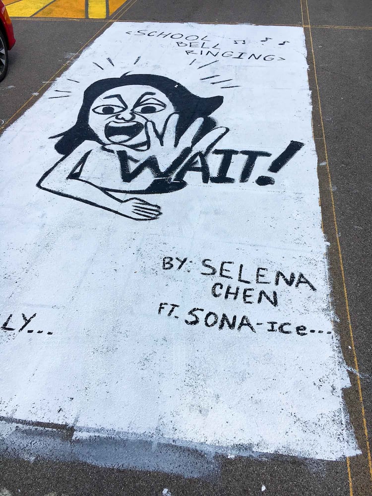 PHOTOS Lakota East seniors paint parking spots