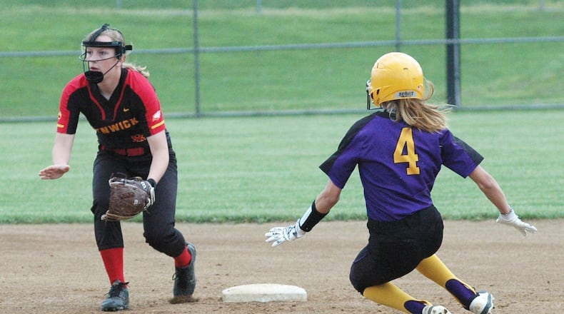 Bellbrook’s Kendall Knisely (4) is safe at second base ahead of the throw to Fenwick shortstop Abby Gustely on Thursday during a Division II sectional softball game in Middletown. Bellbrook won 9-5. RICK CASSANO/STAFF