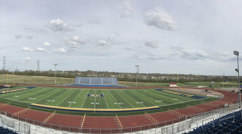 Monroe Schools in Butler County has unveiled its second-generation, artificial turf sports field at its high school but Madison School officials say they are postponing the installation of its first turf field out of money concerns. (Provided photo/Journal-News)