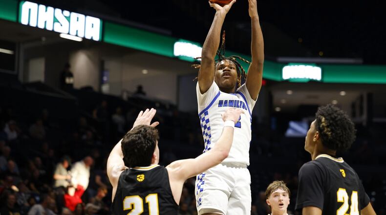 Hamilton's Andrea Holden shoots over Centerville defense during their Division I regional semifinal basketball game Wednesday, March 13, 2024 at Xavier University's Cintas Center. Centerville won 60-35. NICK GRAHAM/STAFF
