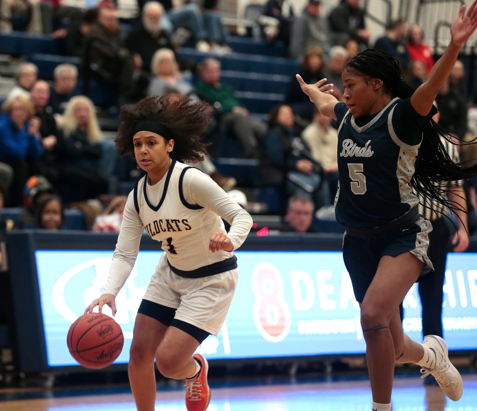 Springfield senior Jada Crockran drives past Fairmont senior Kaylah Thornton. Fairmont defeated Springfield 65-32 in the Division I district semifinals on Monday, Feb. 23, 2026, in Fairborn. STEVEN WRIGHT / STAFF