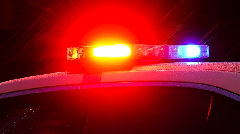 FILE - Shown is a Philadelphia police car with flashing lights in Philadelphia, Monday, Jan. 17, 2022. Police departments reported a year-over-year increase in sworn officers in 2023 for the first time since the COVID-19 pandemic began and since the 2020 police killing of George Floyd spurred nationwide protests and increased scrutiny of police, according to a survey released by the Police Executive Research Forum. (AP Photo/Matt Rourke, File)