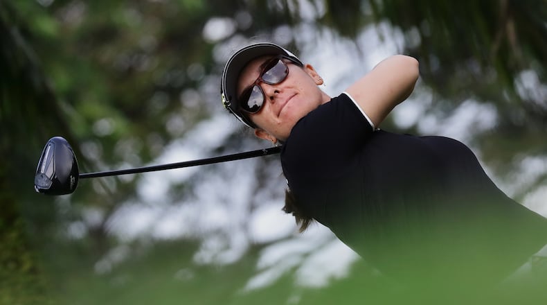 Hannah Green of Australia tees off during the HSBC Women's World Championship at Sentosa Golf Club in Singapore, Thursday, Feb. 26, 2026. (AP Photo/Suhaimi Abdullah)
