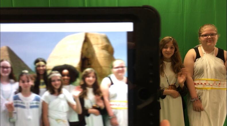 More Lakota Schools are using cmputer-generated, green screen technology to visually transport students to global locations and historic times as part of their classroom learning. Here a group of 6th grade girls participate in Freedom Elementary’s Egyptian Day, donning costumes as they pose in front of the ancient pyramids of the Middle Eastern country.