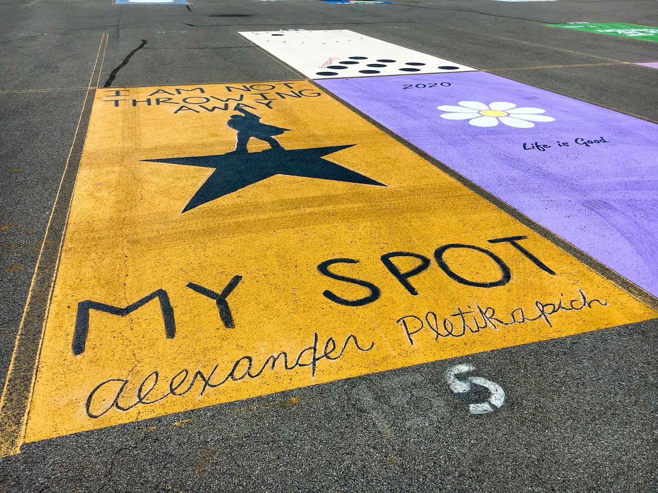 PHOTOS Lakota East seniors paint parking spots