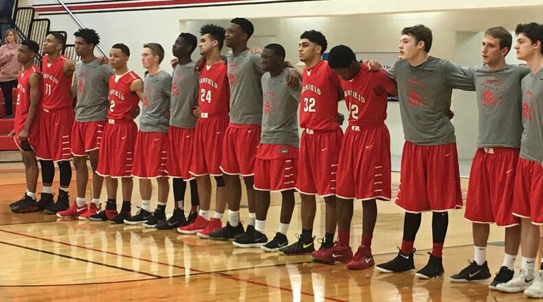 The Fairfield Indians stand for the National Anthem before Saturday’s Division I sectional game against Northwest at Lakota West. RICK CASSANO/STAFF