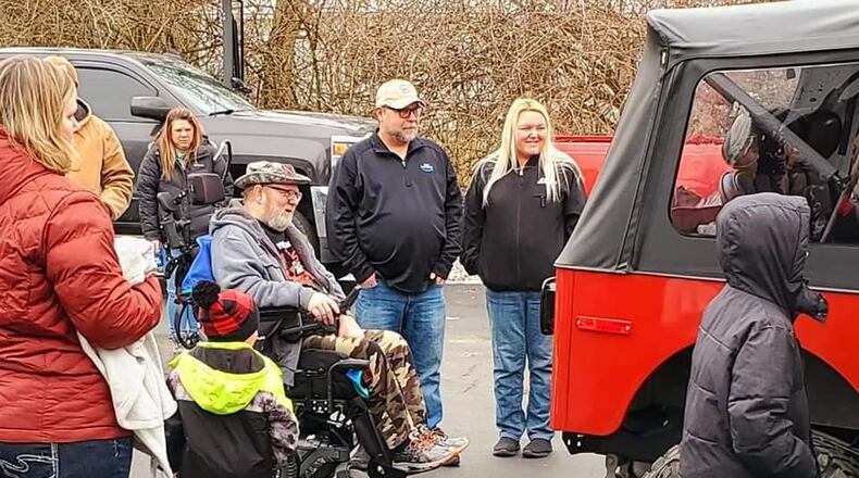Bill Hammock, an Air Force veteran diagnosed with Lou Gehrig's disease, was surprised Saturday when his rebuilt 1979 Jeep was delivered. Numerous volunteers spent the last five months doing about $25,000 worth of repairs to the Jeep. SUBMITTED PHOTO