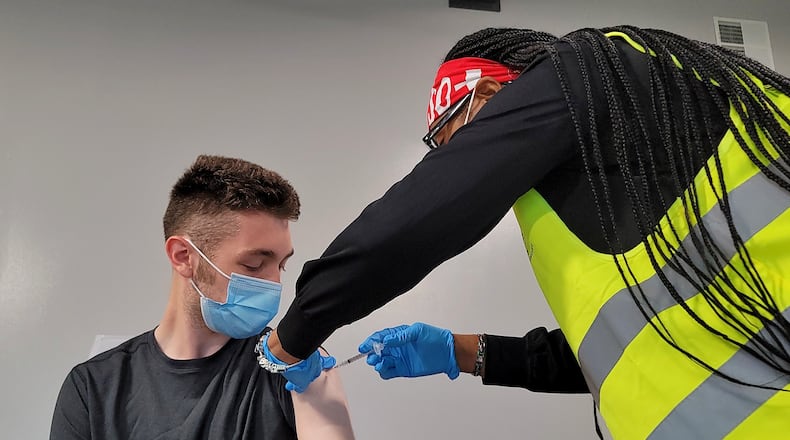 Brendan Dwyer, 17, gets his COVID-19 vaccine administered by nurse Ronisha Reid Wednesday, June 9, 2021 at the Butler County Fairgrounds. The Butler County Health Department with help from other agencies continues their COVID-19 vaccination clinics with Walk-in Wednesdays at the Butler County Fairgrounds in Hamilton. The clinic runs from 9 a.m. until noon on Wednesdays. NICK GRAHAM / STAFF