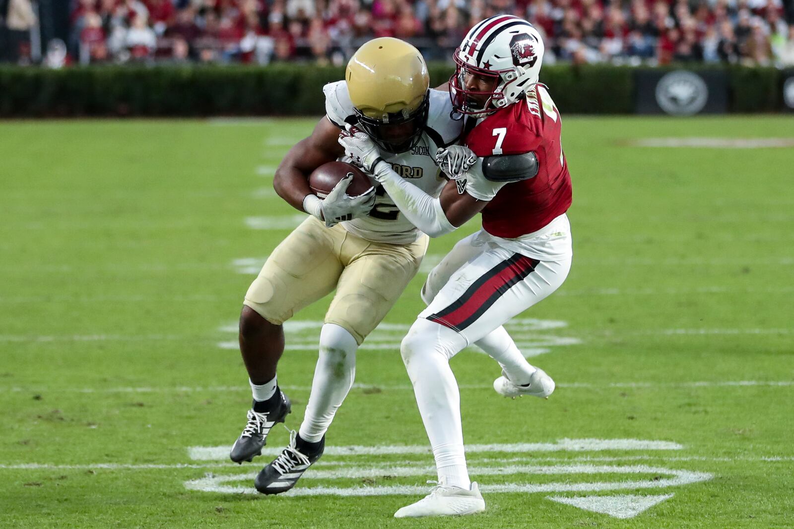 South Carolina defensive back Nick Emmanwori (7) tackles Wofford running back Ryan Ingram, left, for a loss during the first half of an NCAA college football game Saturday, Nov. 23, 2024, in Columbia, S.C. (AP Photo/Artie Walker Jr.)
