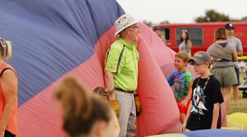 Dr. Mark Frazier inflated his balloon, Release, on Friday, opening night of the Ohio Challenge hot air balloon festival at Smith Park. Frazier, a lifetime Middletown resident, encouraged city leaders to end the lawsuits with a local business. NICK GRAHAM/STAFF