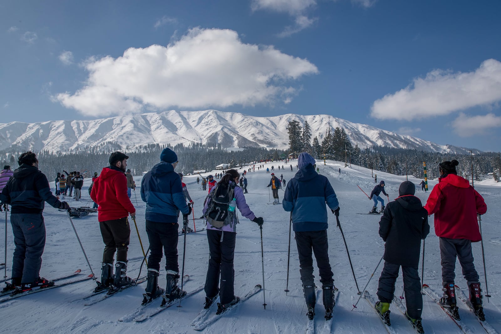 FILE - Tourists wait for their turn to use a ski-lift to transport them up a slope in Gulmarg, northwest of Srinagar, Indian controlled Kashmir, Jan. 10, 2021. (AP Photo/Dar Yasin, File)
