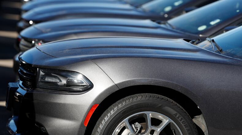 In this Feb. 2, 2020 file photo, a long row of unsold Charger sedans sits at a Dodge dealership in Littleton, Colo. Certified pre-owned vehicles present a great opportunity for used-car shoppers now. (AP Photo/David Zalubowski, File)