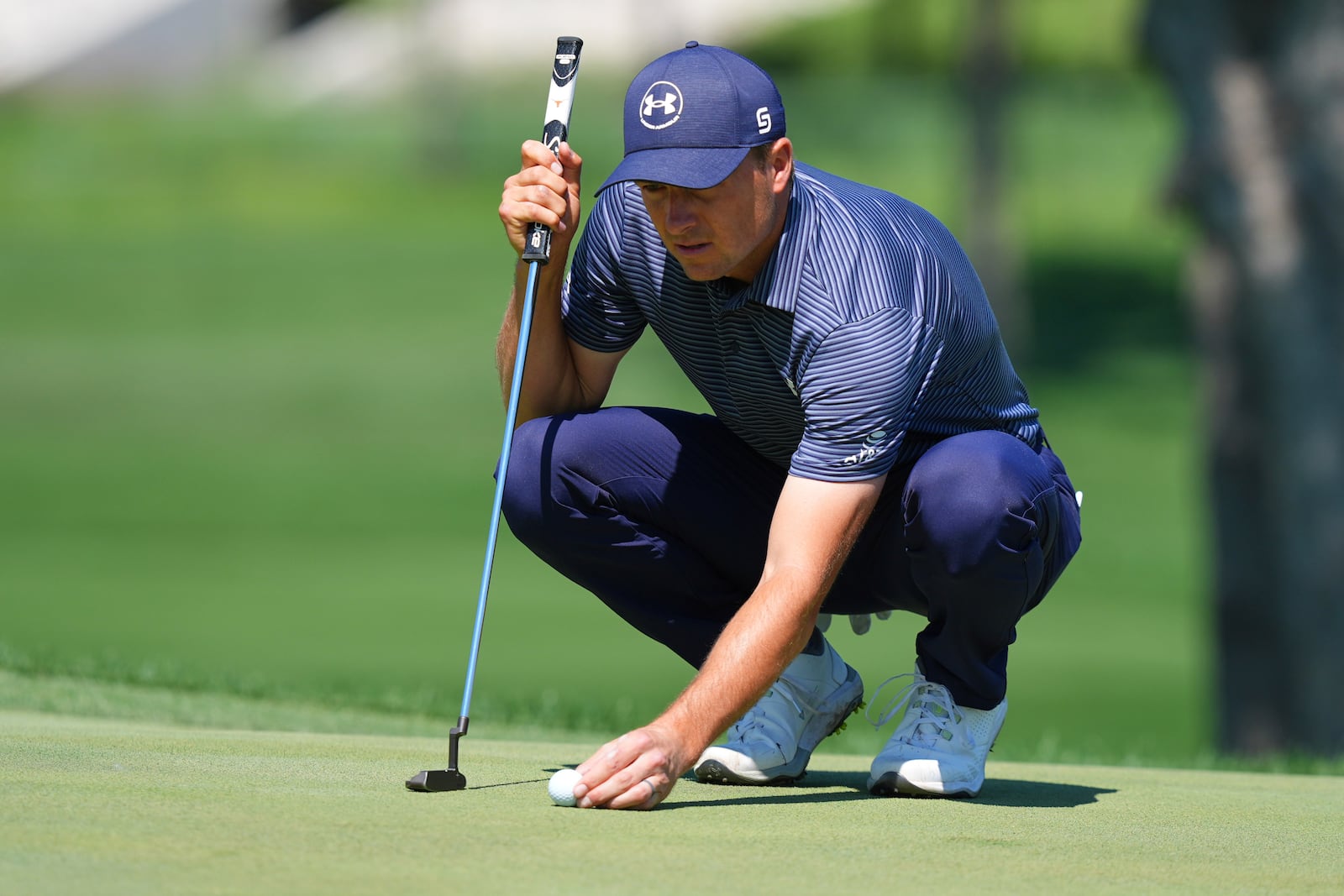 Jordan Spieth sets up for a putt on the first green during the final round of the CJ Cup Byron Nelson golf tournament in McKinney, Texas, Sunday, May 4, 2025. (AP Photo/LM Otero)