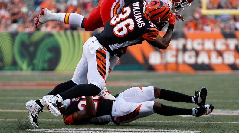 Cincinnati Bengals strong safety Shawn Williams (36) tackles Kansas City Chiefs running back Kareem Hunt (27) during the first half of an NFL preseason football game, Saturday, Aug. 19, 2017, in Cincinnati. (AP Photo/Frank Victores)