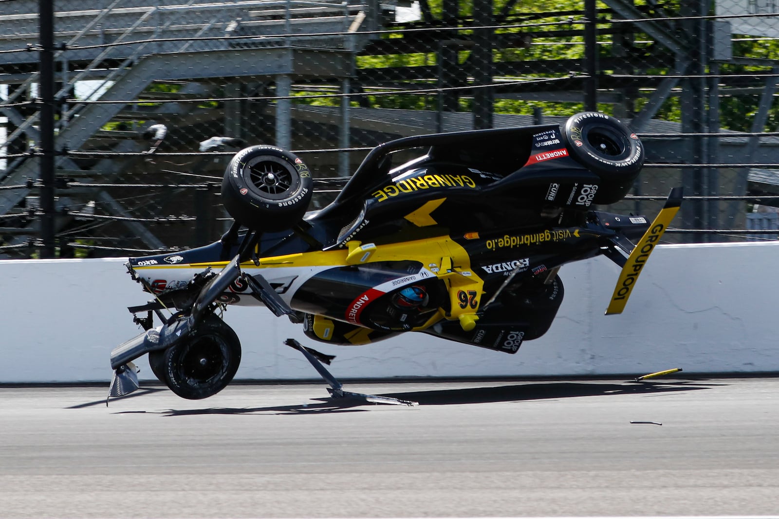 The car driven by Colton Herta goes airborne after hitting the wall in the first turn during a qualification attempt for the Indianapolis 500 auto race at Indianapolis Motor Speedway in Indianapolis, Saturday, May 17, 2025. (AP Photo/Kirk DeBrunner)