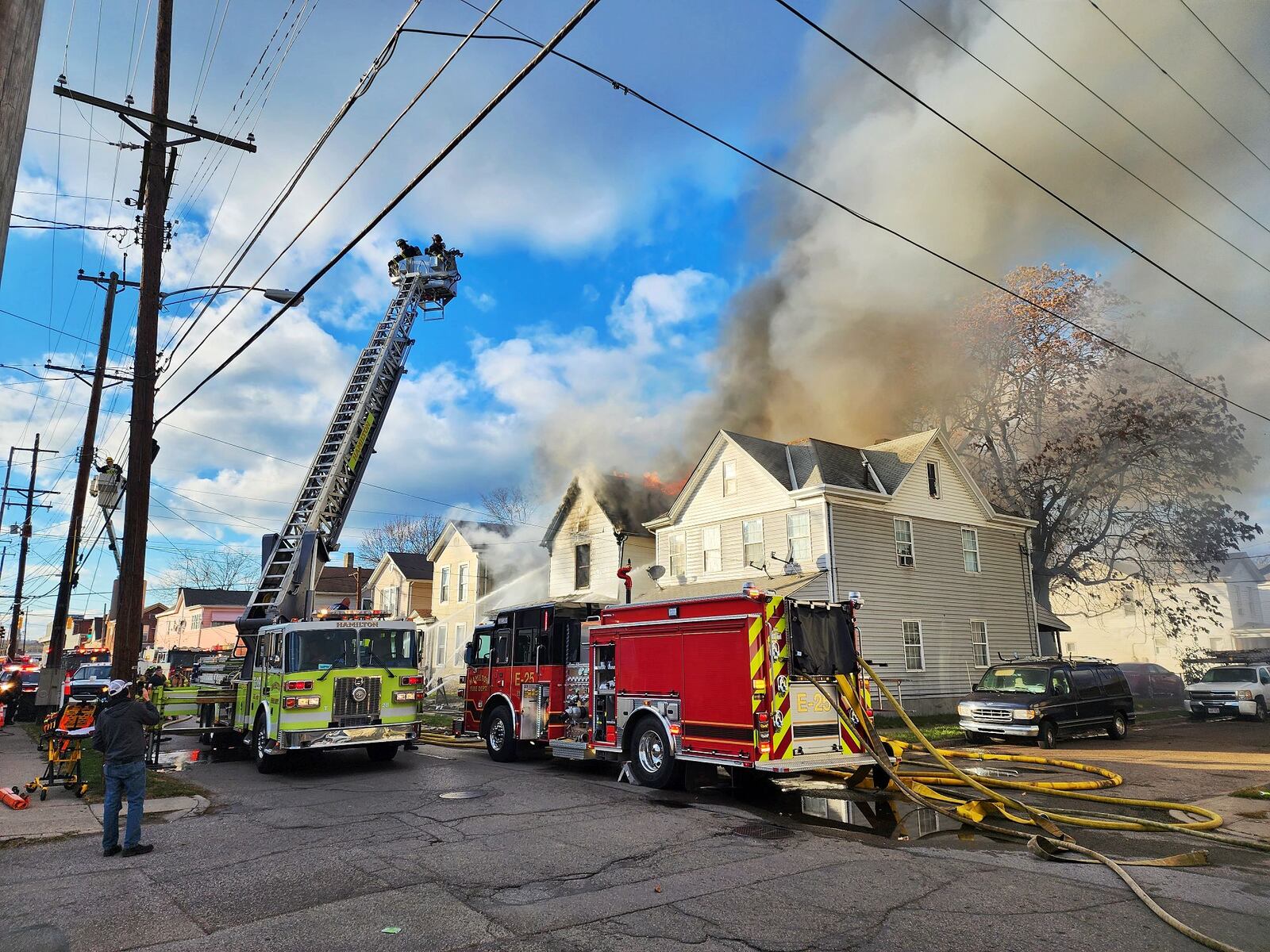 Multiple callers reported a Hanover Street house fire on Friday afternoon, Nov. 18, 2022, in Hamilton. NICK GRAHAM/STAFF