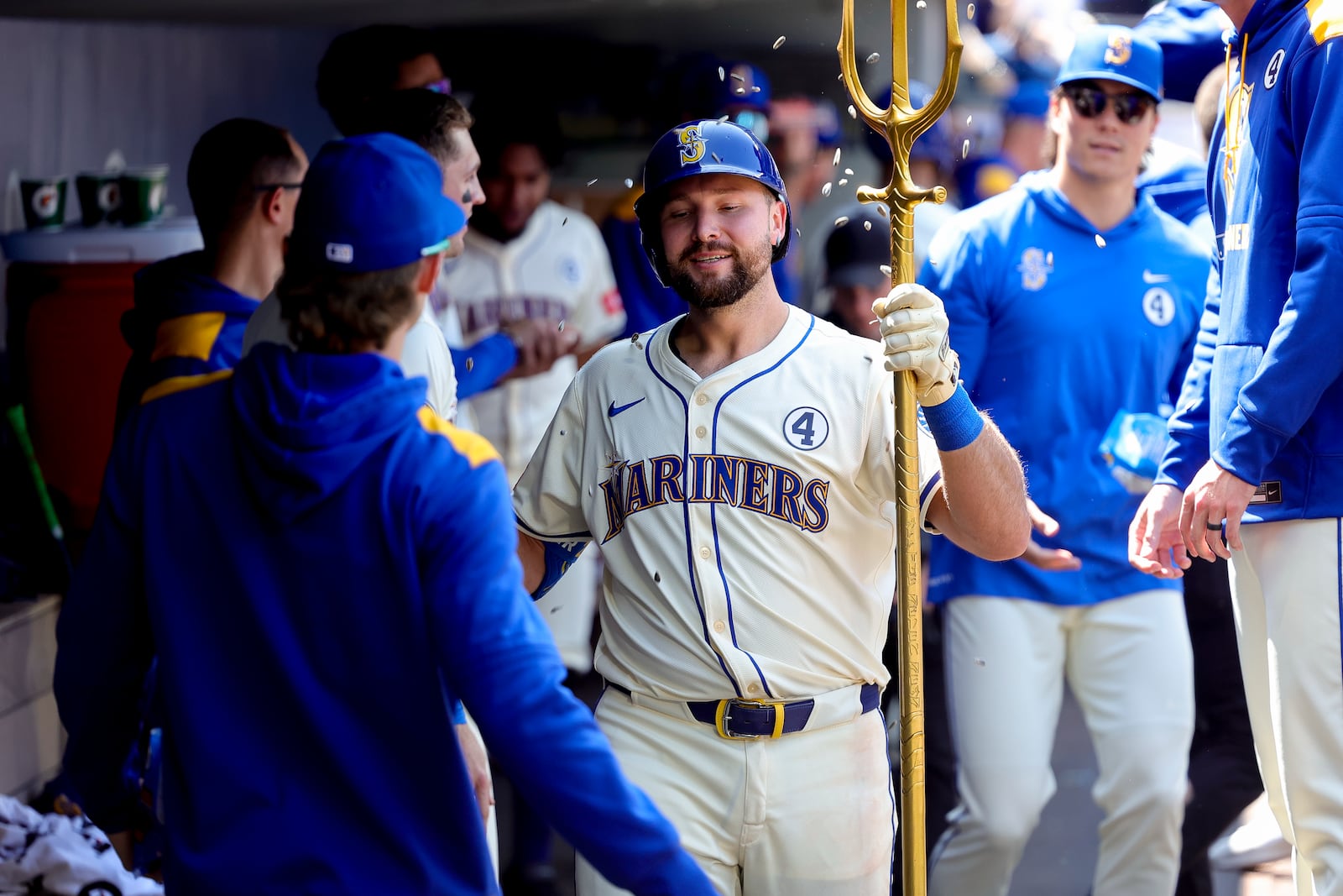 Seattle Mariners' Cal Raleigh, center, celebrates in the dugout after hitting a solo home run during the seventh inning of a baseball game against the Minnesota Twins, Sunday, Jun 1, 2025, in Seattle. (AP Photo/Ryan Sun)