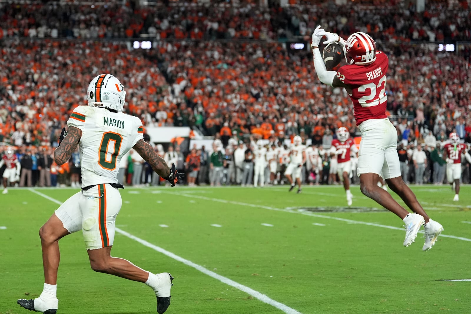 Indiana defensive back Jamari Sharpe intercepts a pass against Miami during the second half of the College Football Playoff national championship game, Monday, Jan. 19, 2026, in Miami Gardens, Fla. (AP Photo/Rebecca Blackwell)