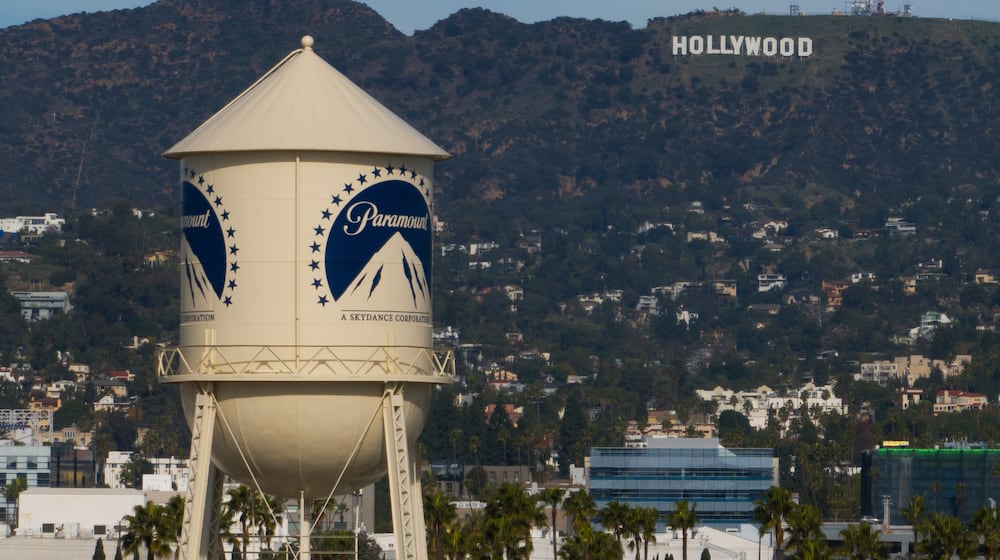 The Paramount Pictures water tower is seen in Los Angeles, Thursday, Dec. 18, 2025, with the Hollywood sign in the distance. (AP Photo/Jae C. Hong)