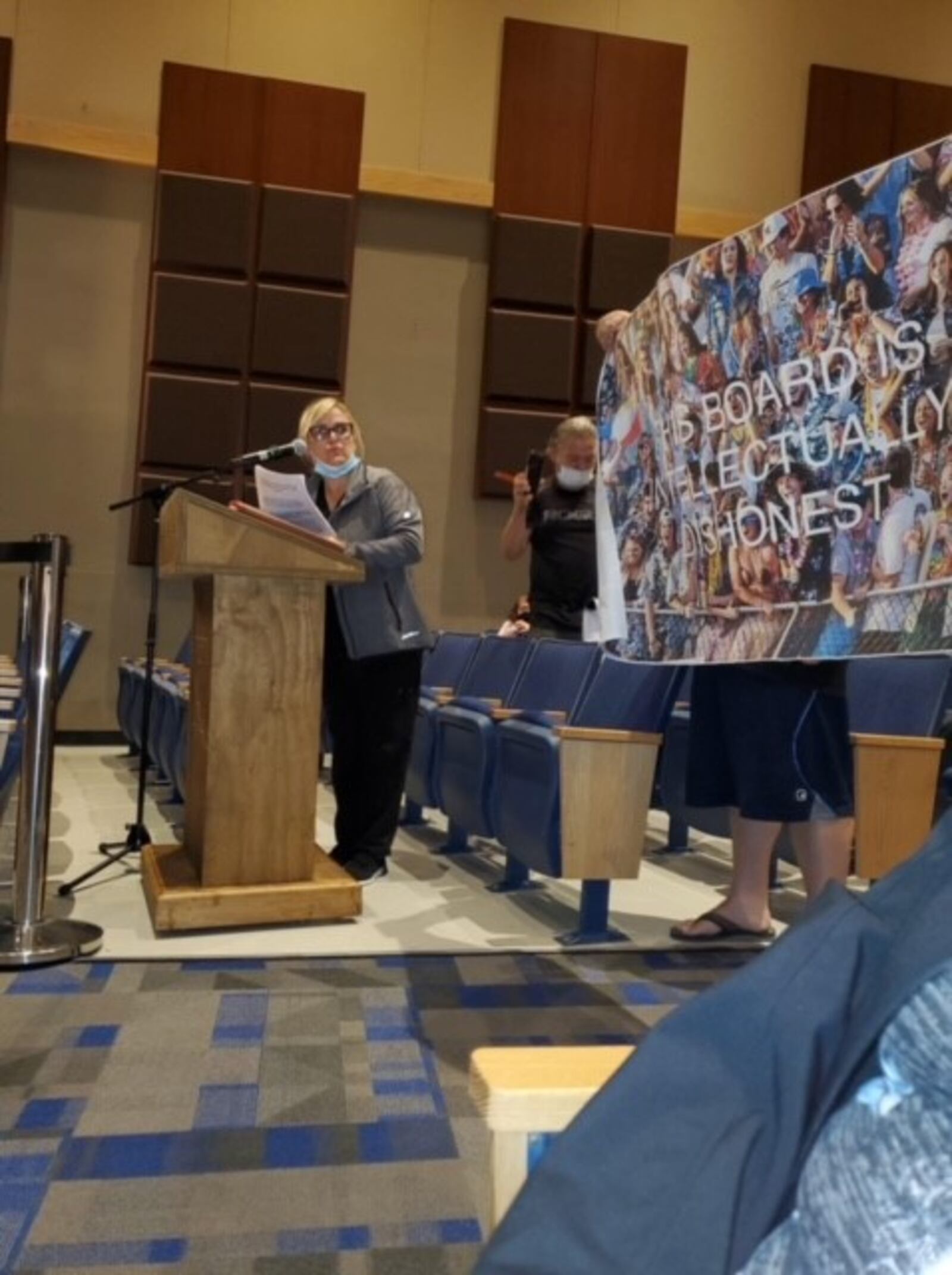 Among the anti-mask speakers at Hamilton school board's recent meeting was one who brought a photo poster reading: "This Board Is Intellectually Dishonest." A Hamilton Police officer working security took the poster and a man who was holding it was ordered by the officer to leave the building, according to the man. (Provided Photo\Journal-News)