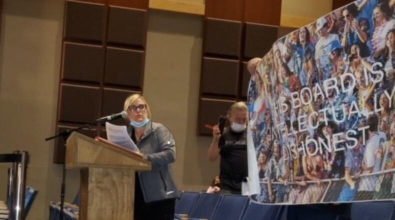 Among the anti-mask speakers at Hamilton school board's recent meeting was one who brought a photo poster reading: "This Board Is Intellectually Dishonest." A Hamilton Police officer working security took the poster and a man who was holding it was ordered by the officer to leave the building, according to the man. (Provided Photo\Journal-News)