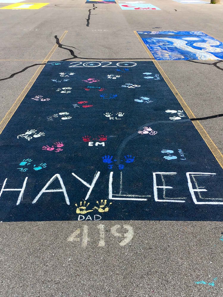 PHOTOS Lakota East seniors paint parking spots