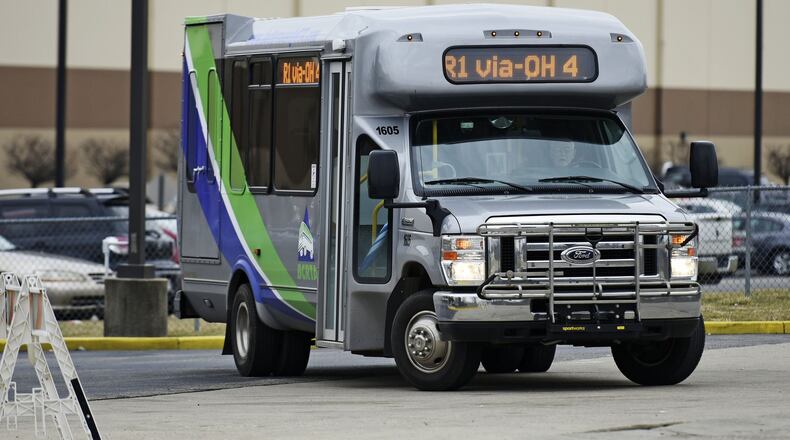 A Butler County Regional Transit Authority bus makes a stop Jan. 19 at the Kohl’s Distribution Center in Monroe. Discussions are underway among Middletown, Monroe and BCRTA about extending express bus service to the Dayton RTA South Dayton bus hub. NICK GRAHAM/STAFF