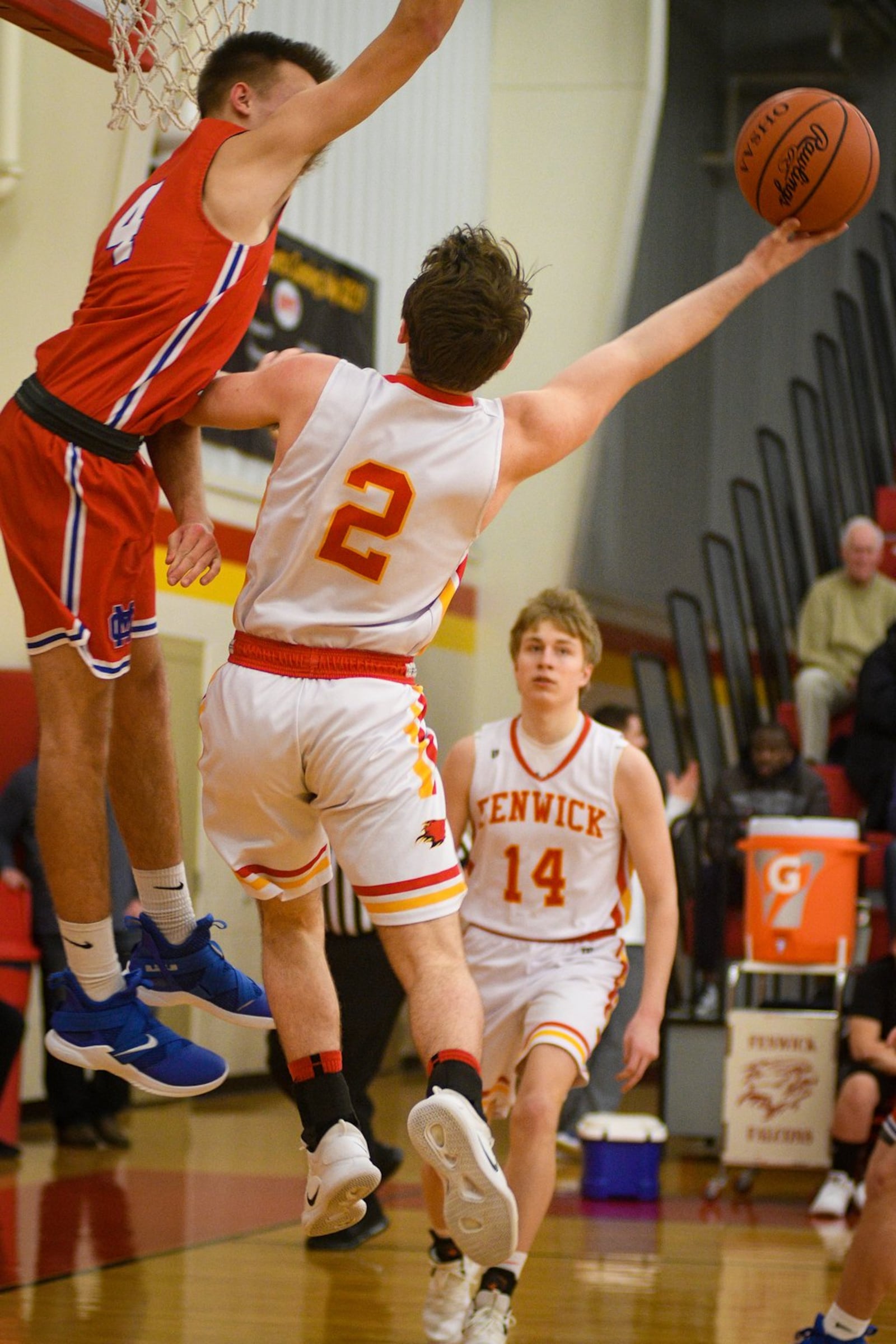 Fenwick’s Jared Morris (2) puts up a shot against Clinton-Massie’s Zach Chowning (4) during Monday night’s game at Fenwick. The host Falcons won 67-48. ROB MCCULLEY/RAM PHOTOGRAPHY
