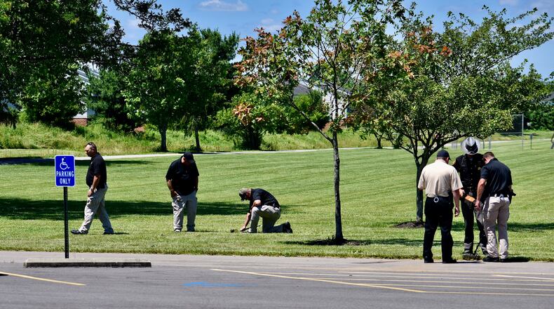 Investigators search Liberty Park in Liberty Twp. for evidence following a fatal shooting there on Wednesday night, June 10, 2020. NICK GRAHAM / STAFF