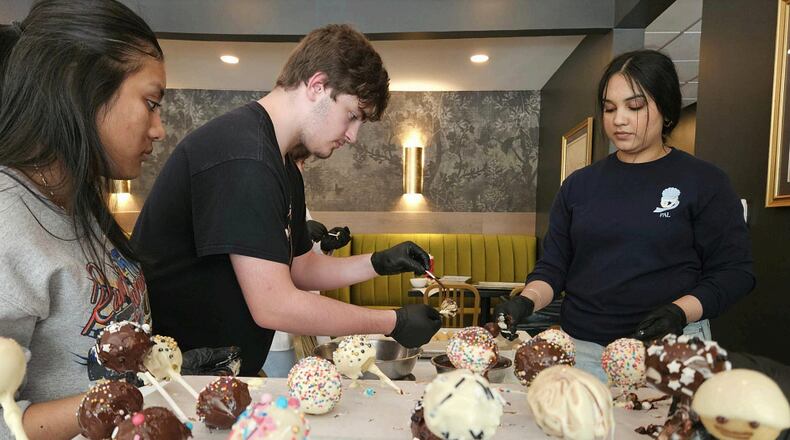 Hamilton High School students recently participated in a Miami University pilot program called “Upward Bound Around Town." Besides making desserts at Tano Bistro, the students visited Hamilton Central YMCA, Fitton Center for the Arts, 3rd Street Music, 17 Strong, City of Sculpture, StreetSpark, and ArtSpace. This venture included learning experiences in which students engaged with the city of Hamilton, explored opportunities and institutions that exist within the city, and developed a sense of community pride, said Ashley Hopkins, director of Miami University TRIO Upward Bound (MUUB). SUBMITTED PHOTO