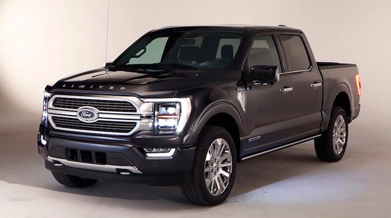 In a photo from, Wednesday, June 24, 2020, the new 2021 Ford F-150 truck is photographed in Ferndale, Mich. Six years ago, Ford bet big on the top-selling vehicle in America, rolling out a radical new version of the F-Series pickup with a lighter aluminum body instead of steel. Now it's time for another revamp, and Ford is playing it safe. On the outside, the truck changes little. The biggest differences are a gas-electric hybrid version, internet connectivity, and a revamped interior that turns the truck into more of a rolling office or even a place to nap. (AP Photo/Carlos Osorio)