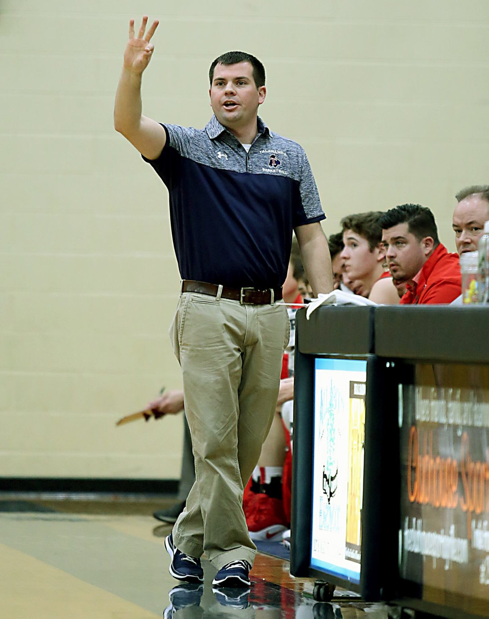 Talawanda coach Eddie Glaser signals a play to his team Tuesday night during a game at Monroe. CONTRIBUTED PHOTO BY E.L. HUBBARD